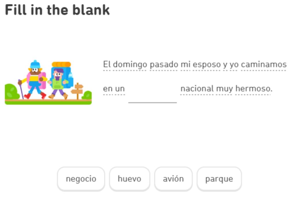 Another Duolingo picture, this time with a gapfill activity. Next to the activity is a small cartoon of two people hiking.